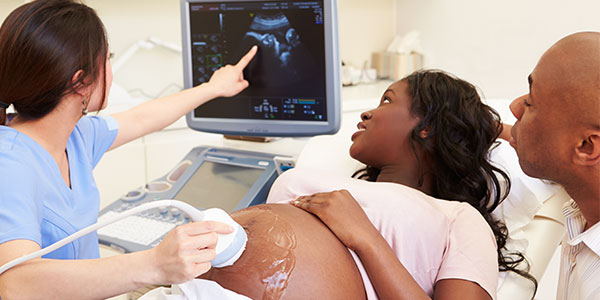 Couple looking at ultrasound
